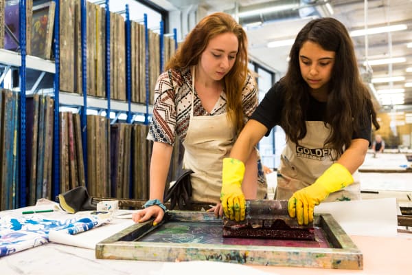 Two Summer Study Abroad students working together on a textile design project