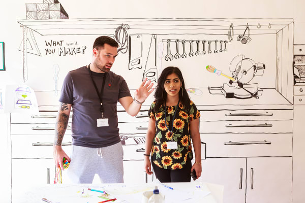 Two people discussing a project