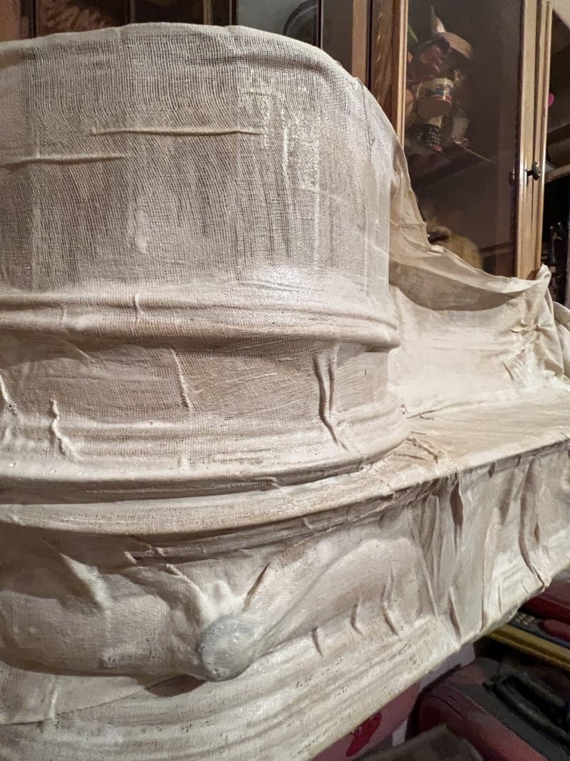 The process of creating the casts, painting latex on top of the cloth while it's positioned on the furniture.