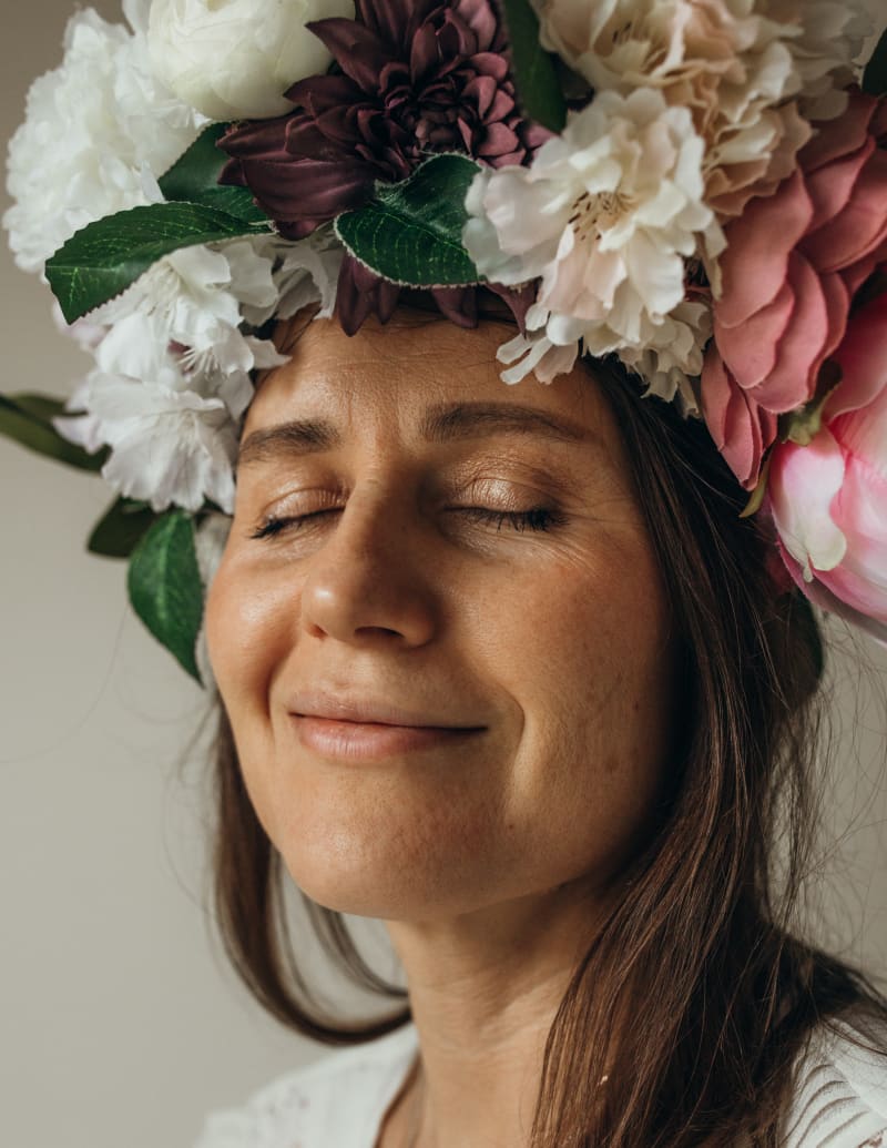 A women with her eyes closed looking relaxed. 