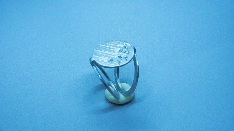 contemporary ring, stracture like a origami, star setting, many gemstone stars on the ring face.