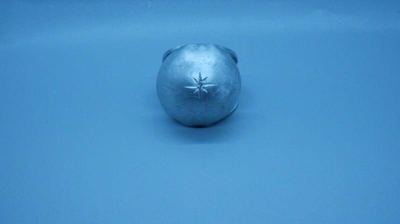 aluminum hemisphere, on the top of it star setting a cz.