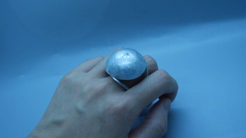 aluminum hemisphere, on the top of it star setting a cz.