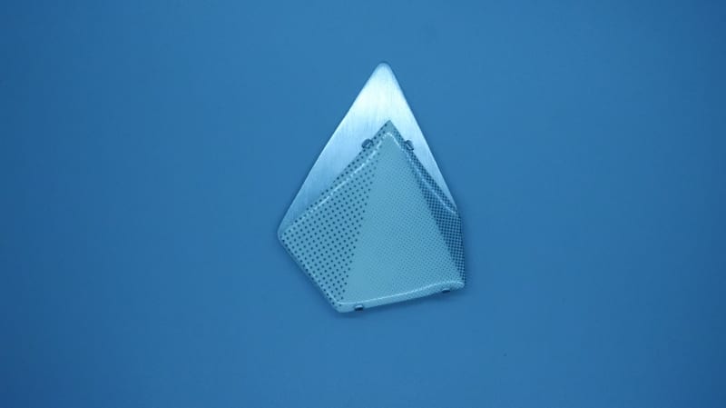  ceramic triangular pyramid with a silver shadow, it looks like 3D but it is 2D.