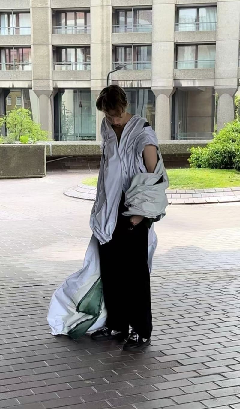 man right 45 degrees with head lowered in garment