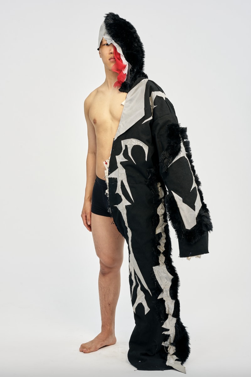 man wearing garment used fur, canvas, metallic reflective fabric
