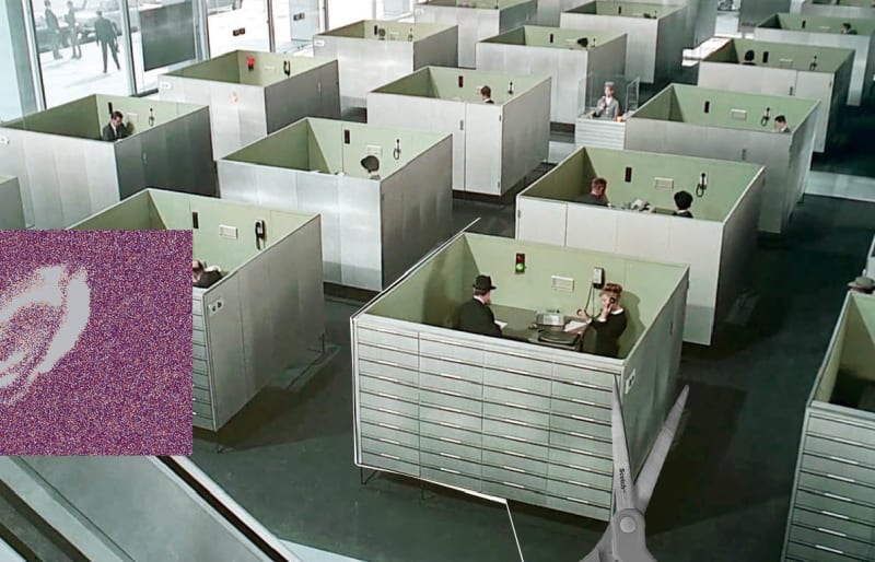Office cubicles lifted from Playtime and placed onto a natural beach landscape.