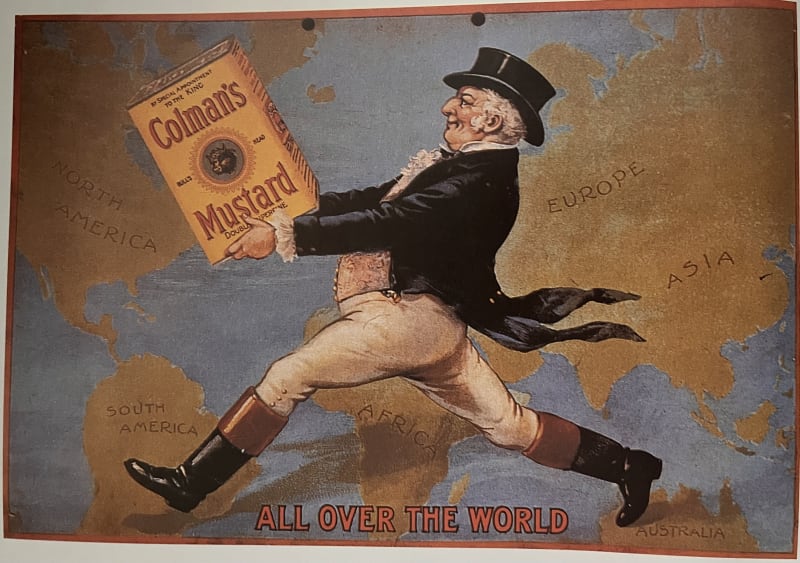 An image of a man carrying an oversized pot of mustard