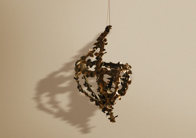 Mobile object 'Payonk' suspended against a clean background, casting a soft, diffuse shadow