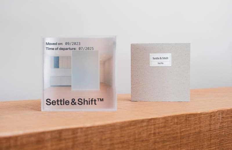 A translucent acrylic box and an archive titled Settle & Shift document a lived space from move-in to departure.