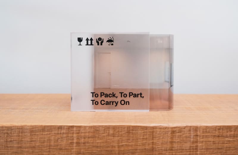 A translucent acrylic box and an archive titled Settle & Shift document a lived space from move-in to departure.