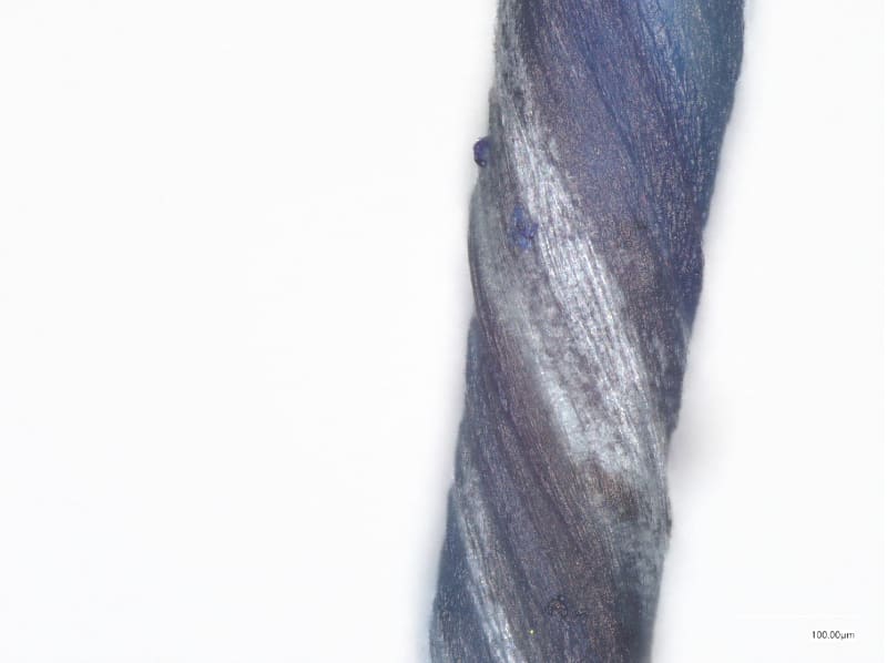 A microscopic image of a twisted yarn.