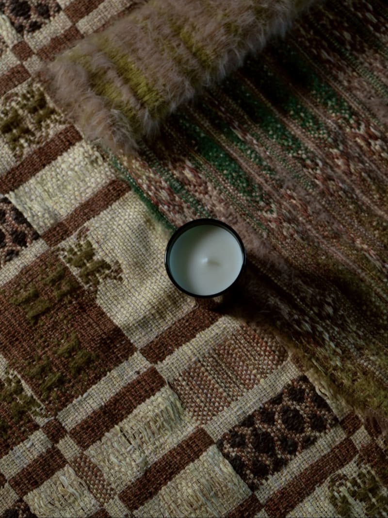 Woven coasters on table with Strié block point patterns, linen and mohair