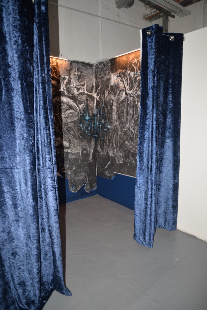 charcoal drawings behind a navy curtain