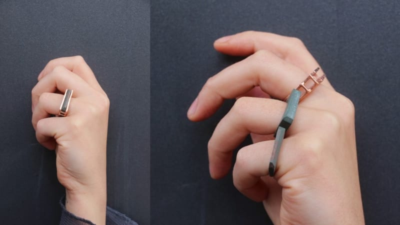 2 images of slate and copper rings being worn on a hand. 