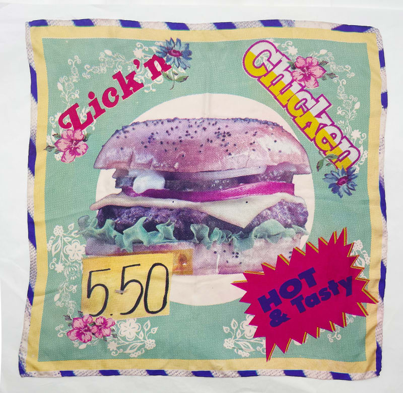 flat lay image of hand made silk scarf with a burger in the middle. Green and blue colours 