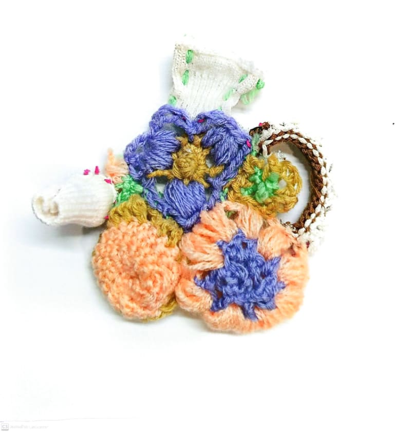 Floral patterns, beloved in teapot design, are reimagined through delicate knitting that reflects the beauty of sculpted petals.