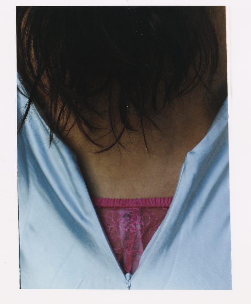 Photo shows pink lingere under a blue prom dress.