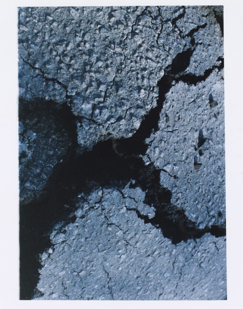The photo shows a broken piece of ground.