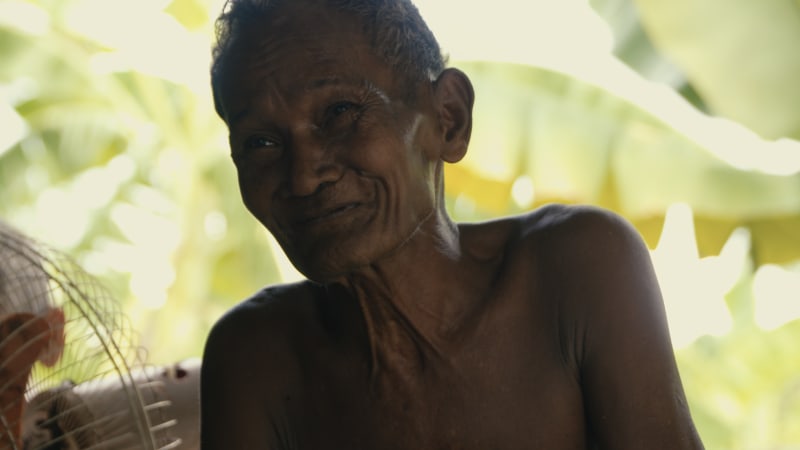 A still of main contributor Chan Voeun being interviewed at home