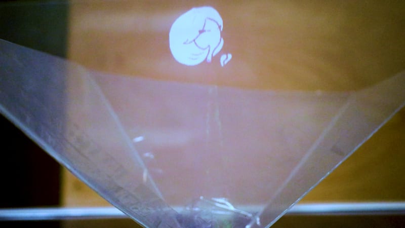 A close-up of the inverted pyramid Pepper's Ghost, reflecting an image of the fairy