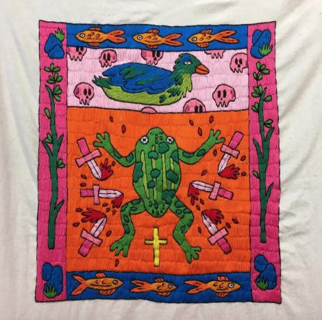 A quilt featuring a duck and a frog surrounded by fish, skulls, knifes and flowers. 