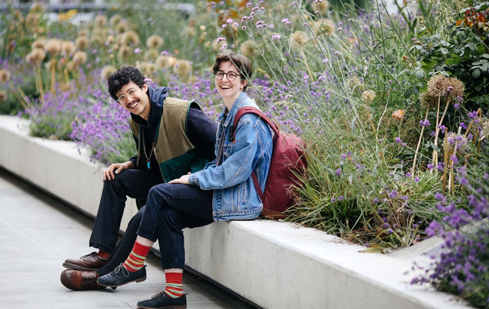 students sitting in garden