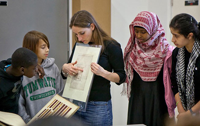 Judy Willcocks, Head of the Museum and Study Collection at Central Saint Martins, showing students a paper archive