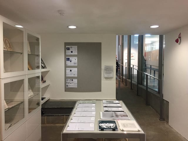 A table with various documents on