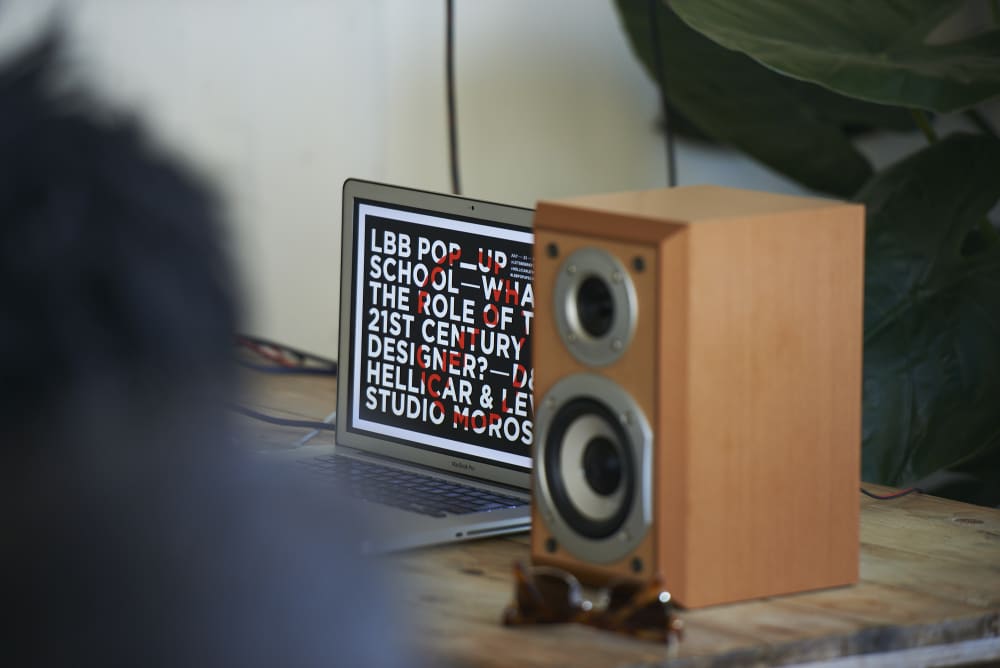 Laptop behind a speaker