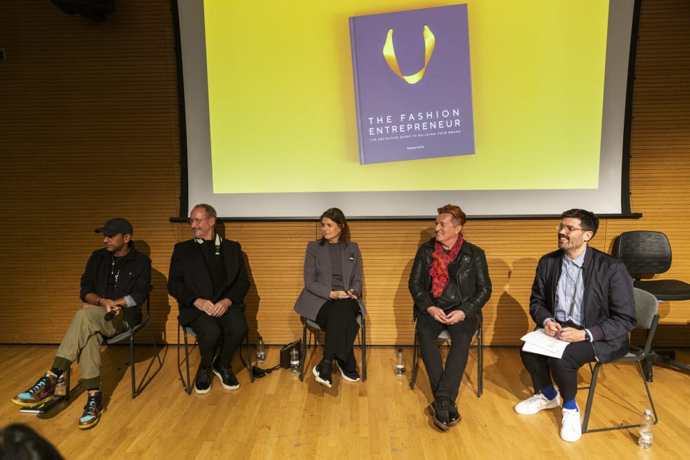 The panel all sitting, looking to the right