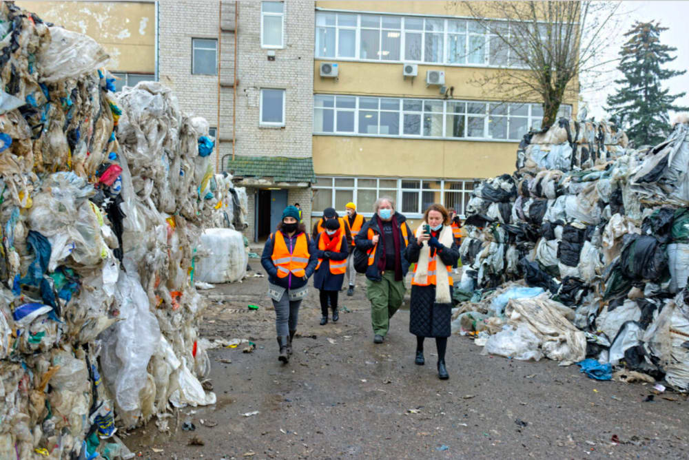 Group of people visiting a plastic recycling plant