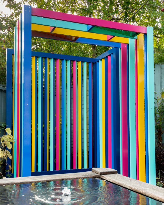 Multi coloured bars over a bench. 
