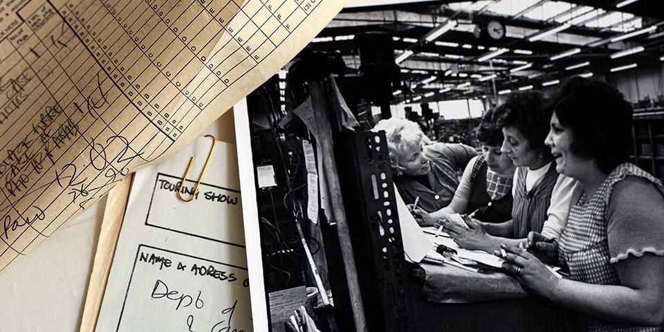 Photograph of a film photograph of women working around a desk