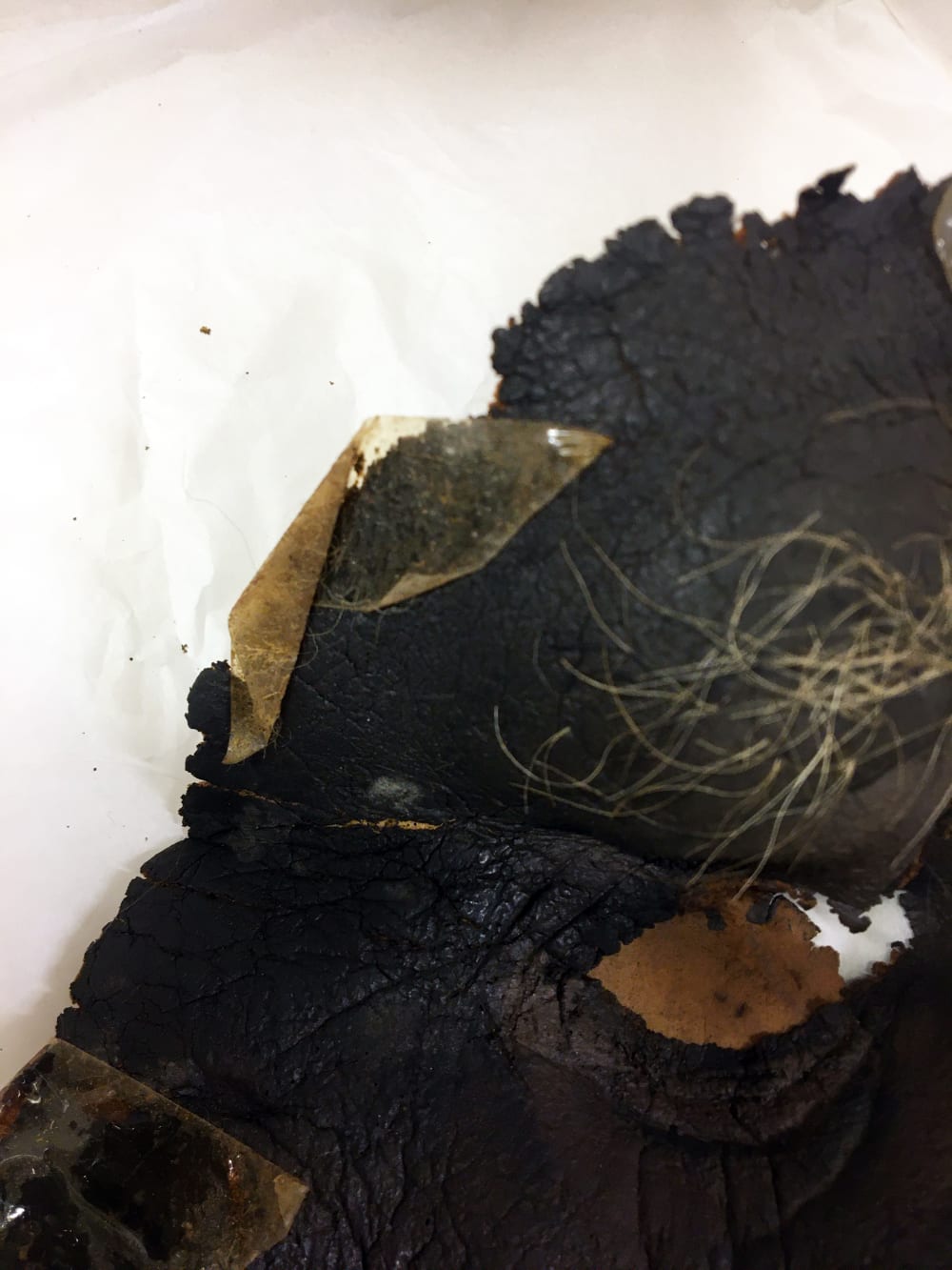 Yellowing tape on brown ape mask