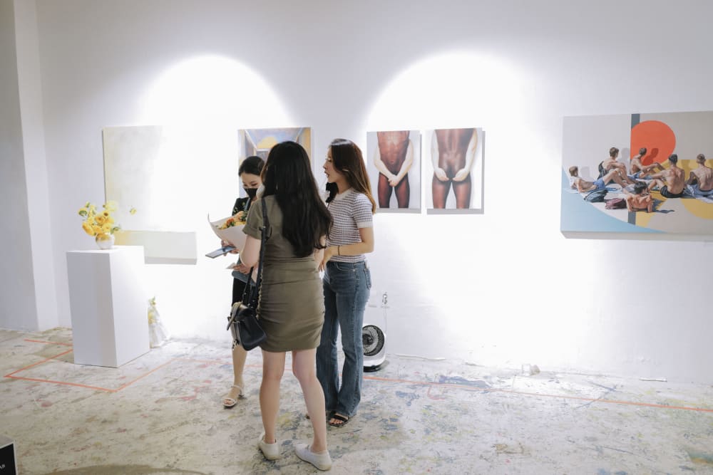 Guests chatting at the exhibition