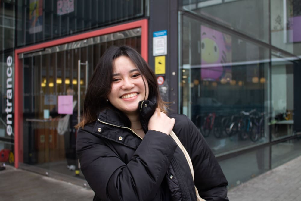 Jazmine smiling outside LCC reception
