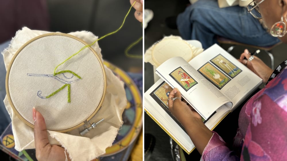 people looking at books and embroidering eyes