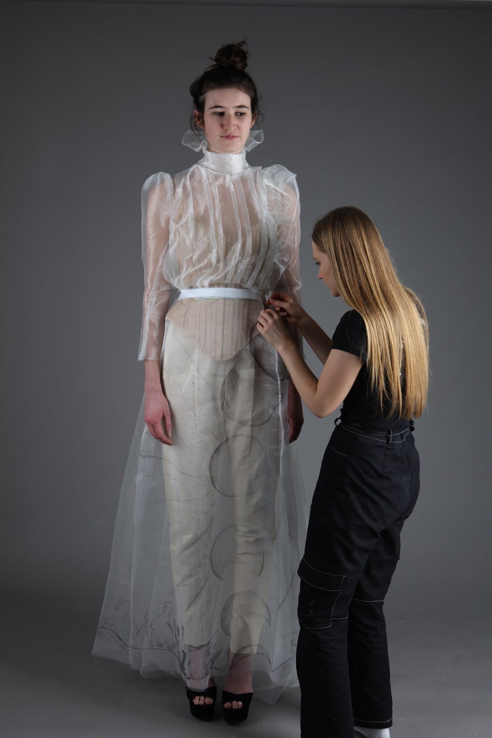 Evie fitting her witch costume on a model