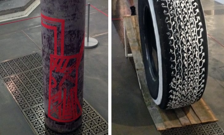 two images, one displaying a motorbike tyre, the other a cylinder with an abstract red pattern painted on