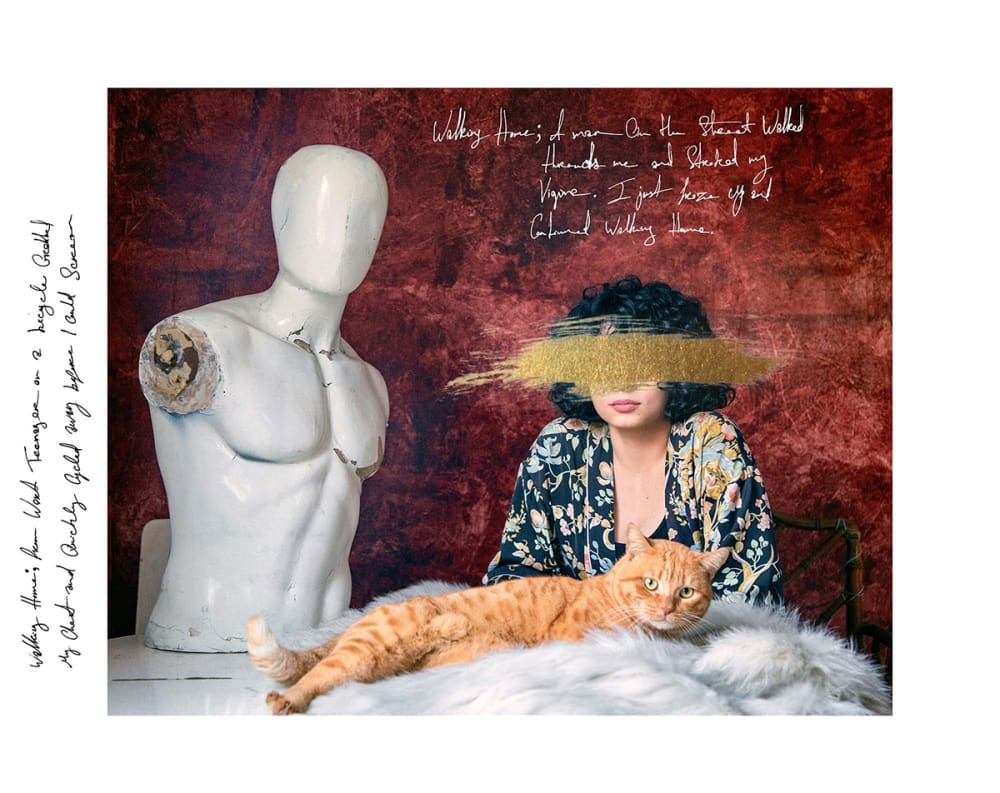 A photograph of a woman and a cat.