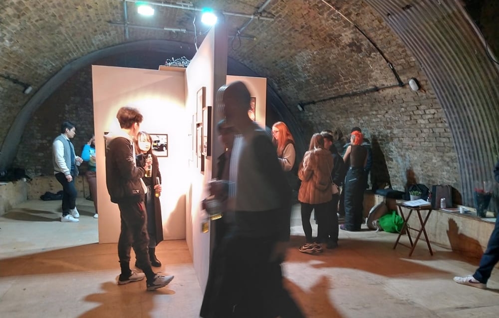 Students interact with exhibited work.