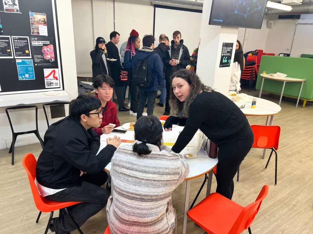 Students gathered around a workshop