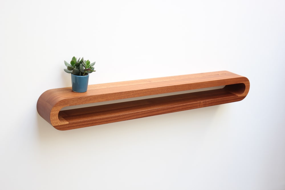 a piece of wood looped to make a sheld