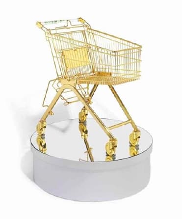 a gold shopping trolley artwork by Sylvie Fleury
