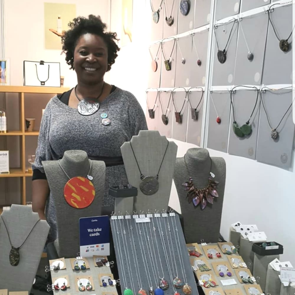 Woman stood behind jewellery