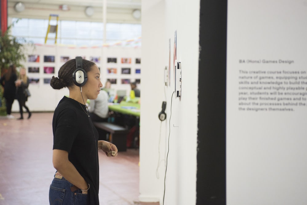 Girl listening to sound installation with earphones