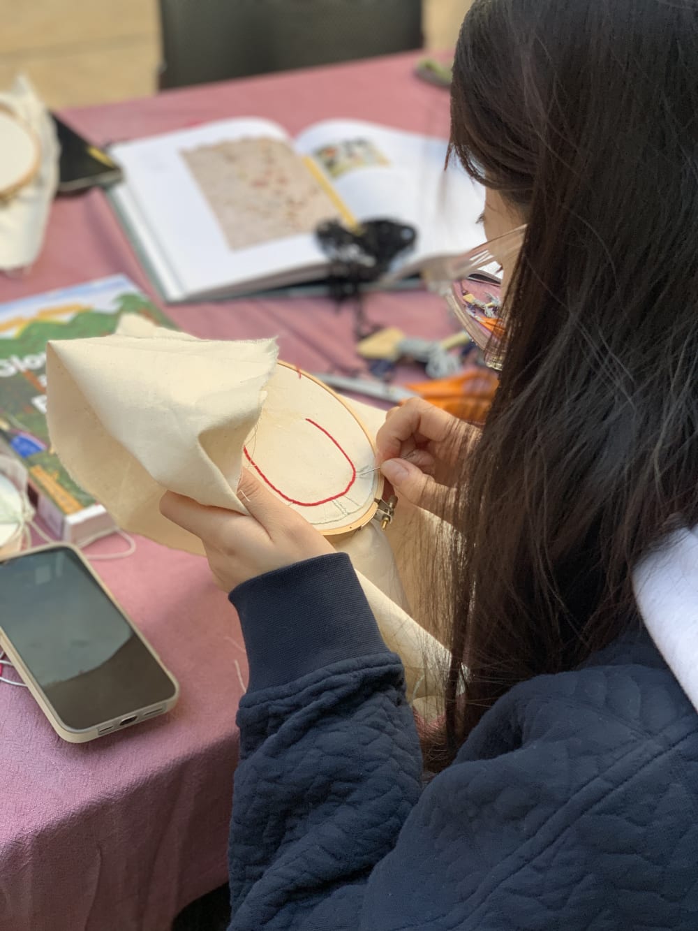 a person embroidering