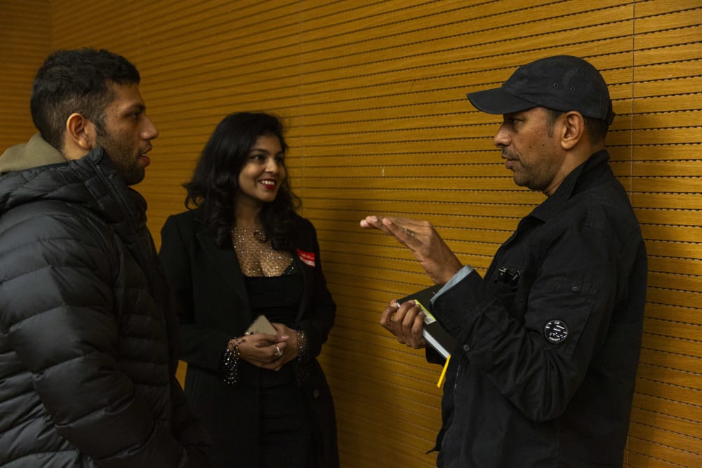 Raoul Shah talking to guests after the panel