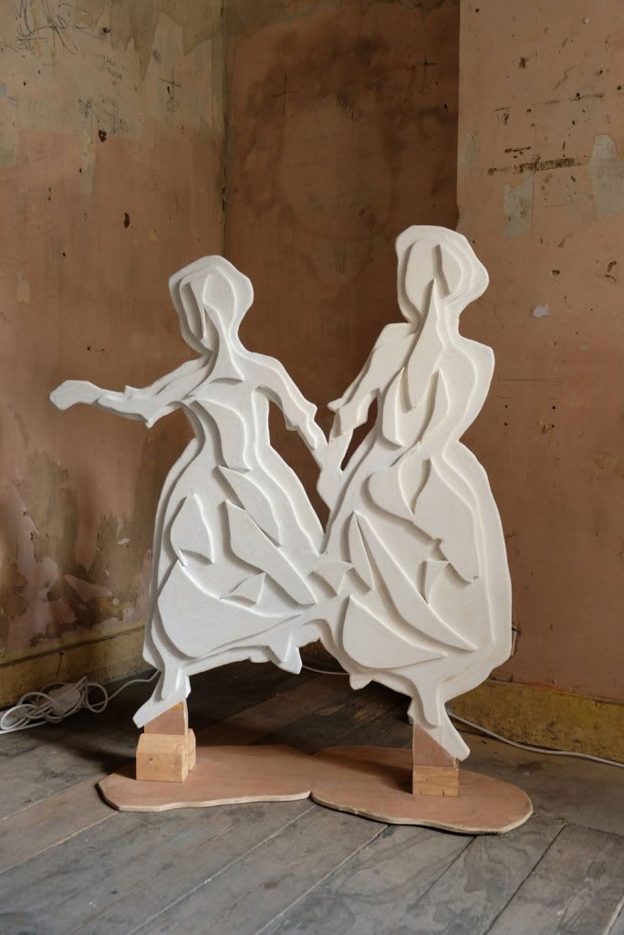 A statue of two girls.